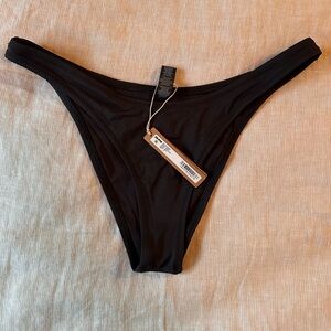SKIMS Black Cheeky Tanga Swim Bottom